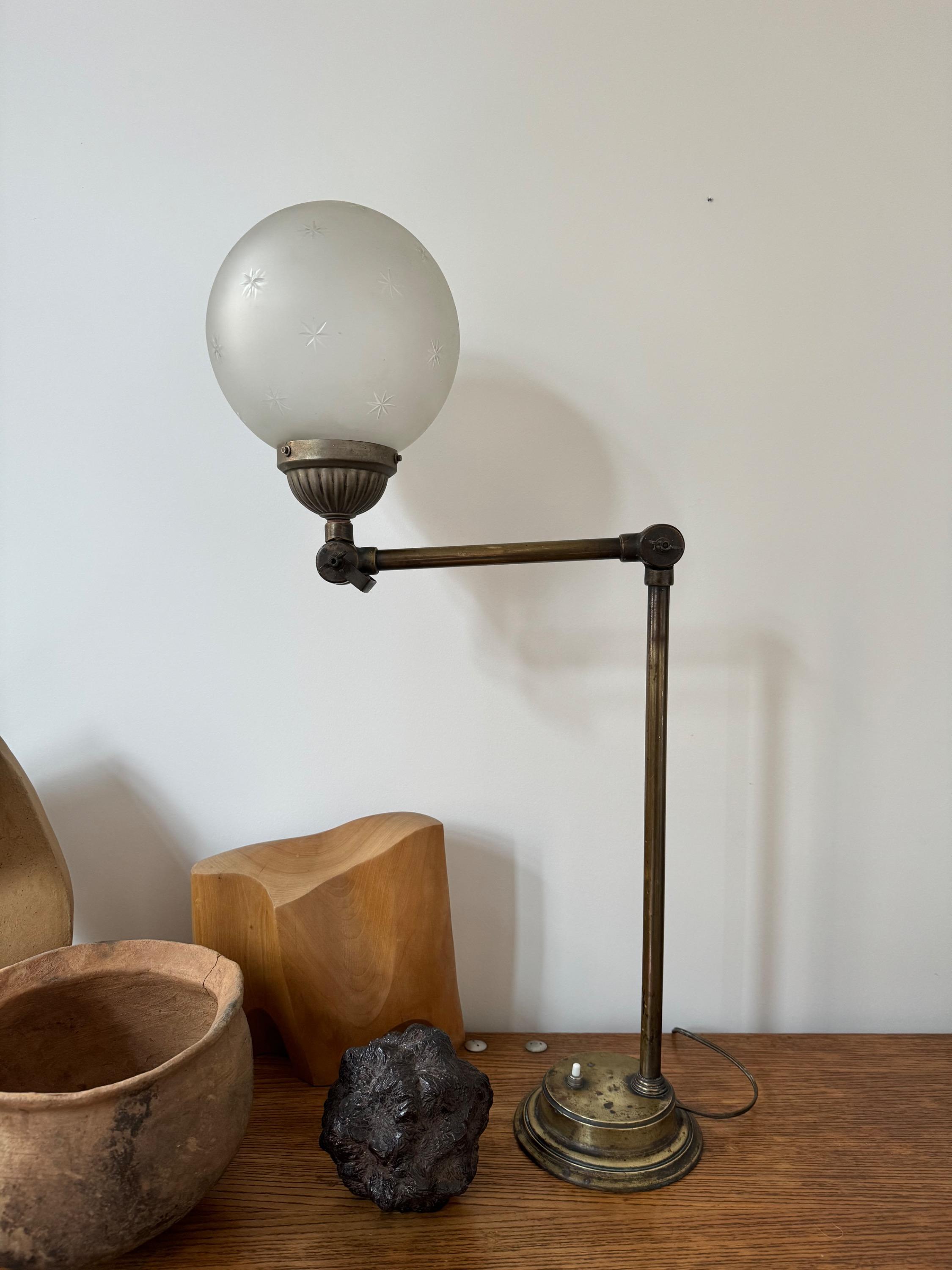 1920’s French Adjustable Table Lamp, In Brass, Metal & Nice Glass Ball With Stars engraved. Dim = H max 80 / Diam Glass Ball 20 cm