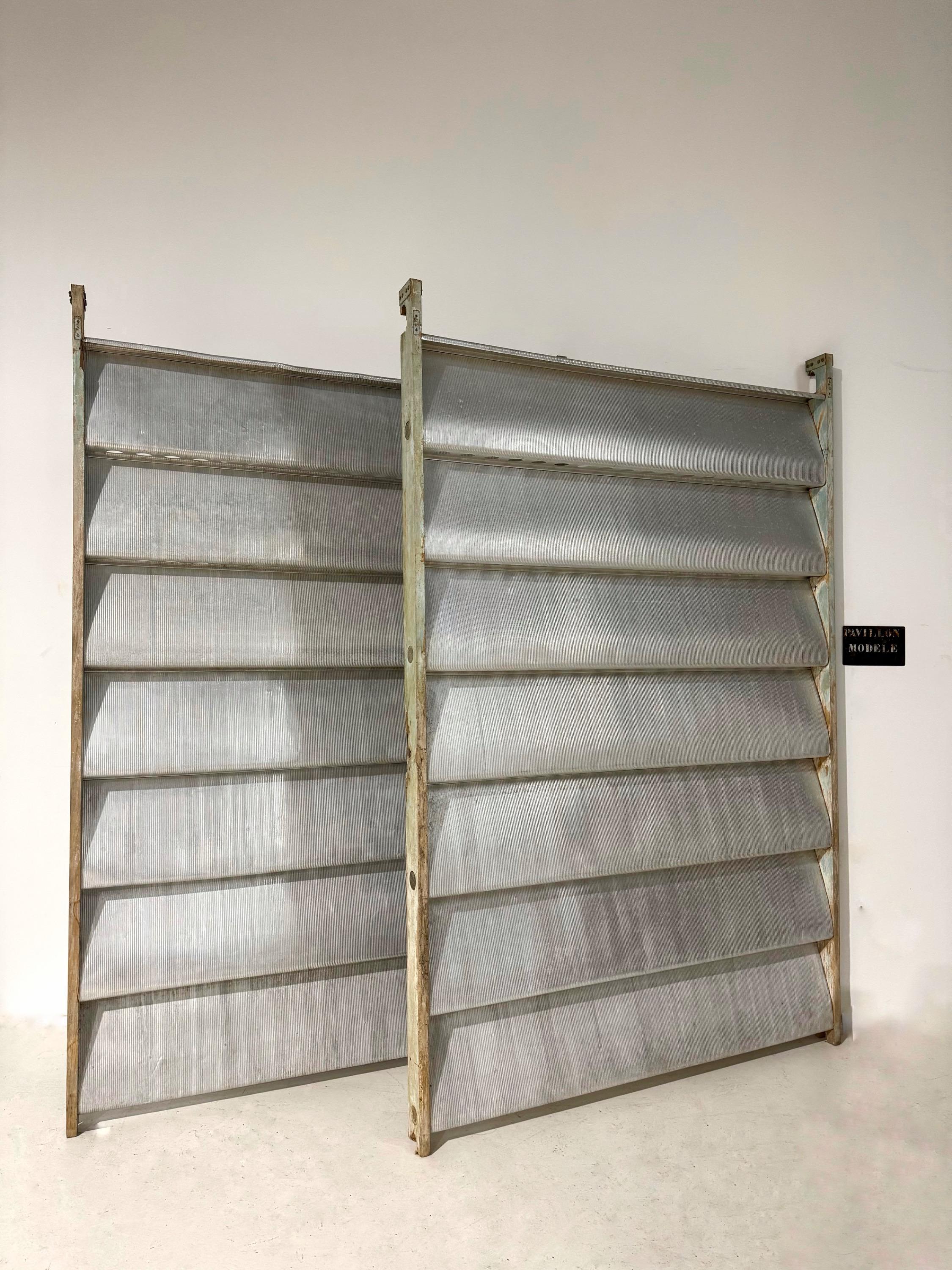 A Pair of Jean Prouvé « Ondes »Aluminium & Painted Wood Sliding Panel, Africa 1963