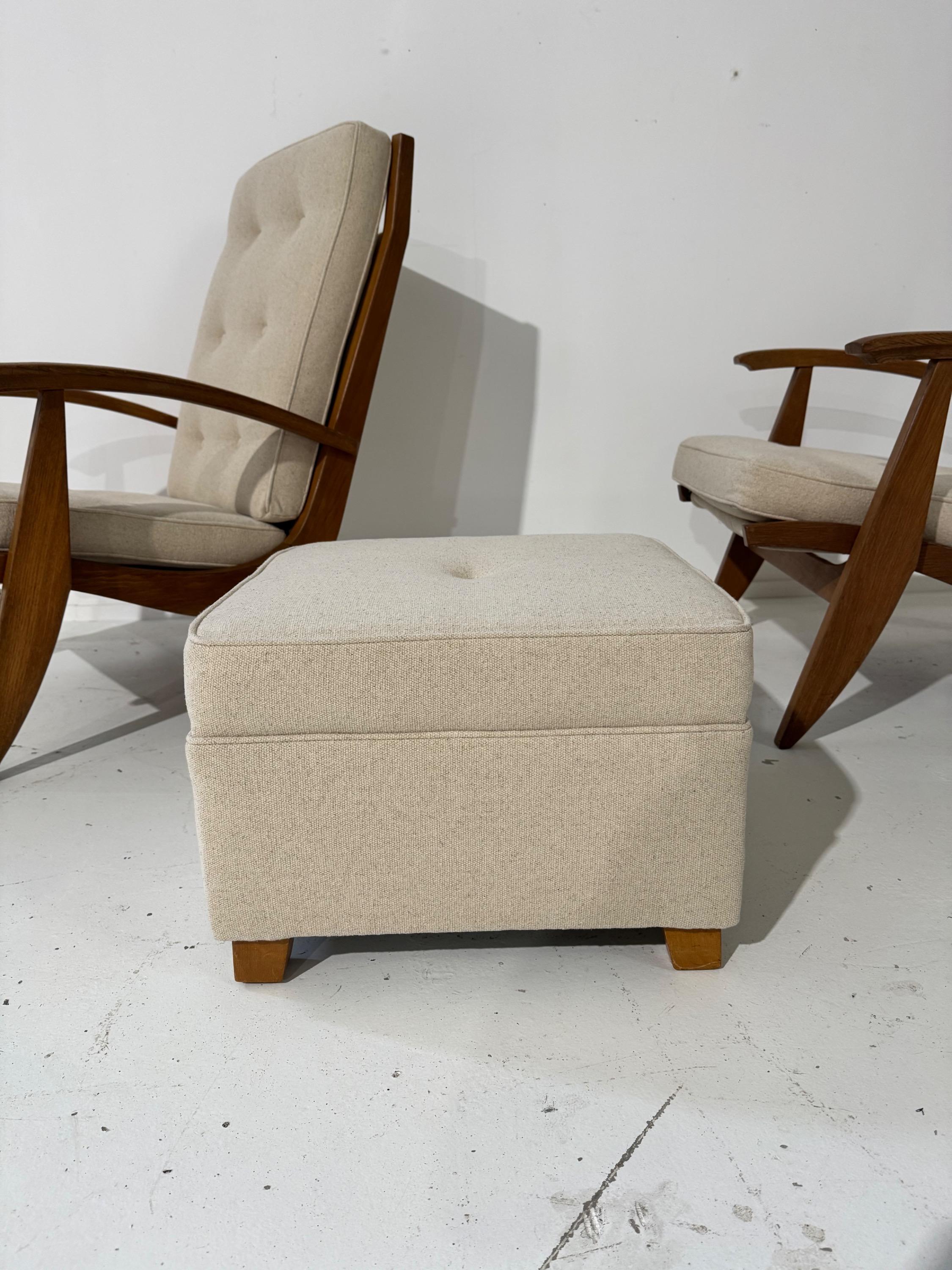 Pair of French Armchairs & Footstool by Guy Besnard FS134 édition Free-Span Circa 1950,covered in Natural Linen.