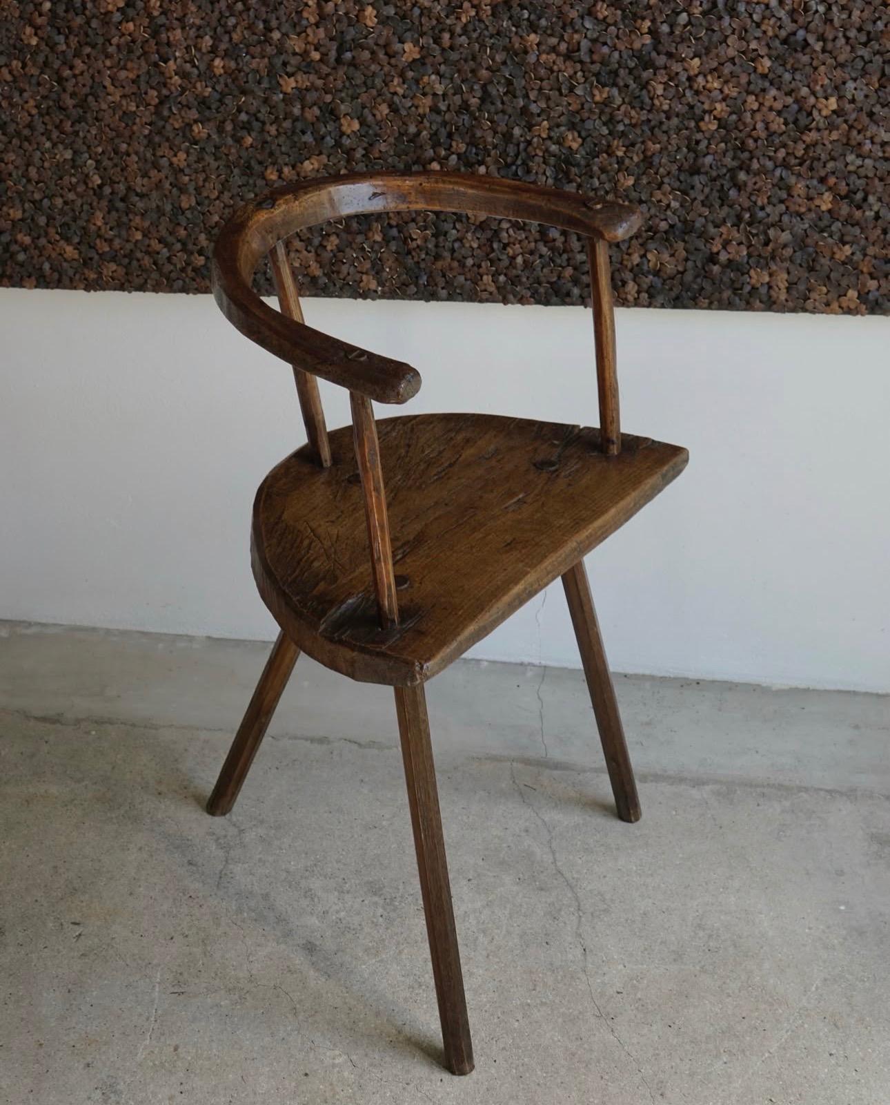 Primitive three-legged wooden chair, end of 18th century