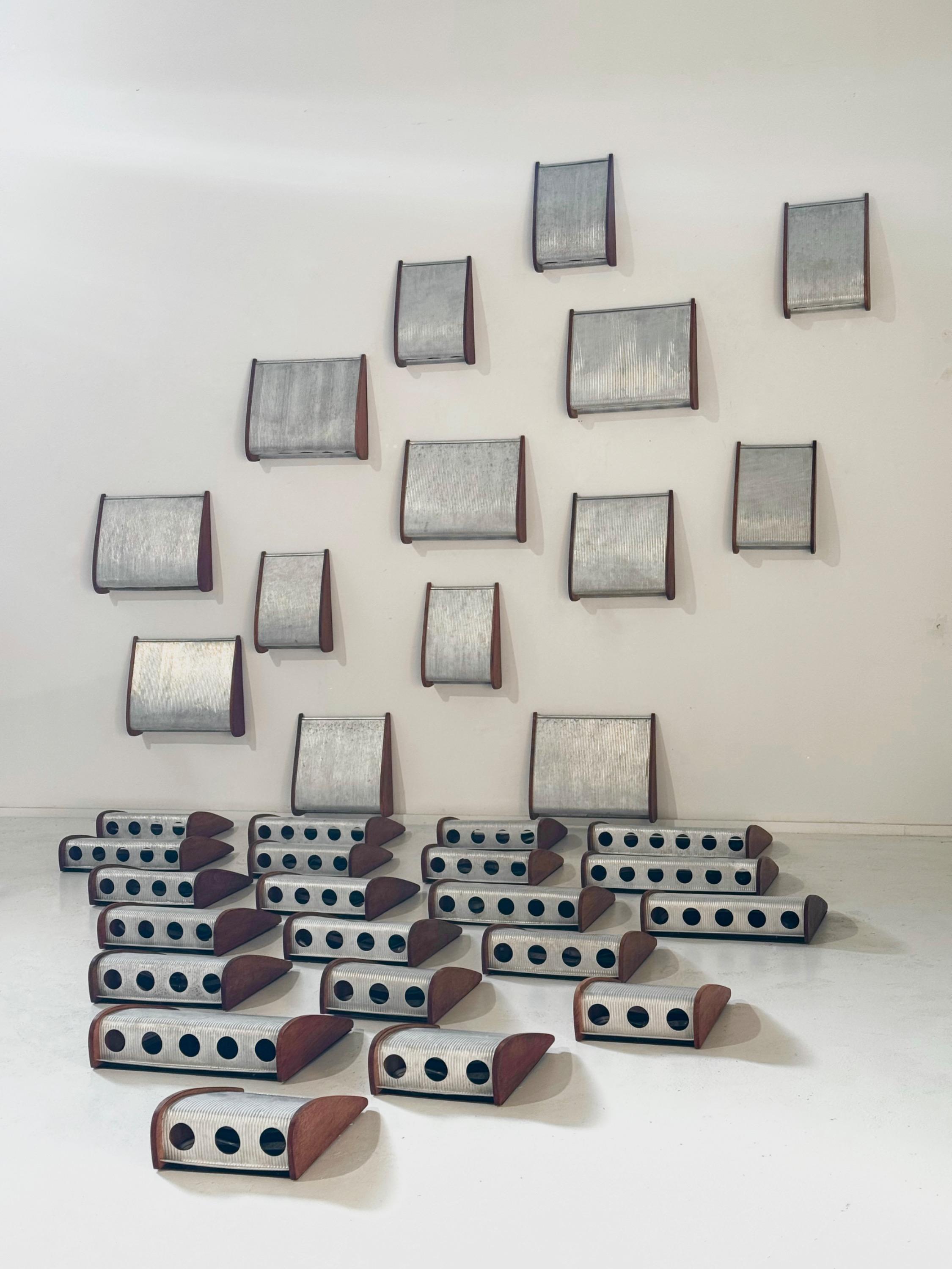 When we buy Jean Prouvé’s buildings in Africa, many elements are very damaged and unusable. So, an excellent idea came, made lamps with these famous aluminum elements. Several sizes, Sold in pairs 